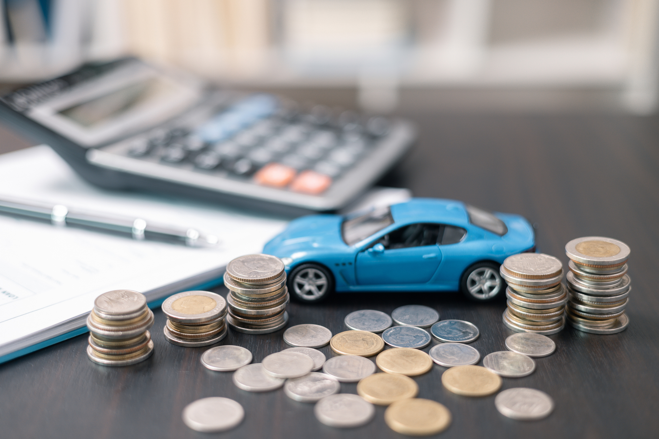 Business concept involved using finance calculator to determine premium for vehicle policy, ensuring clear financial contract for car. Investing in auto insurance can save money on transport costs.