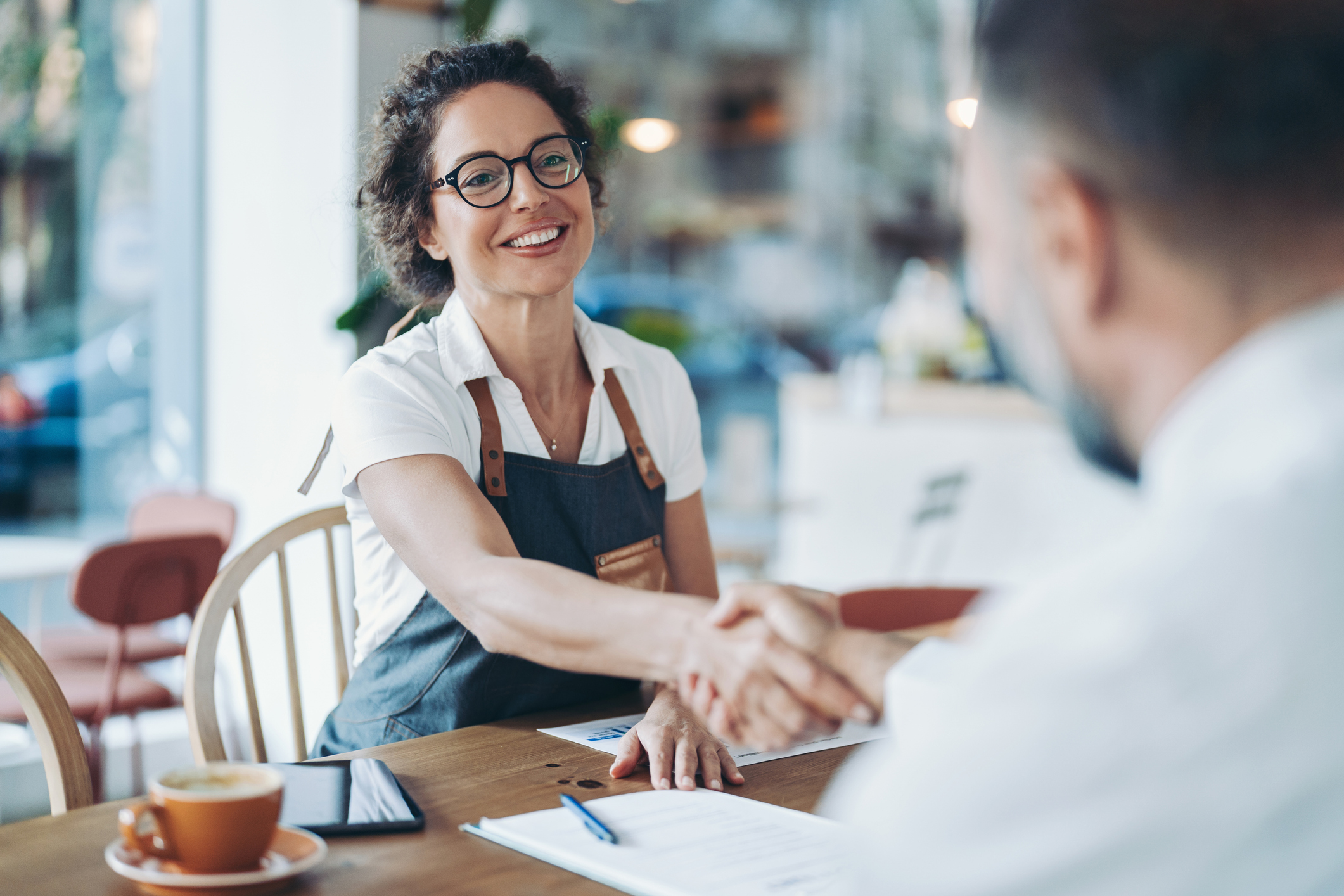 Restaurant owner meeting with an investor